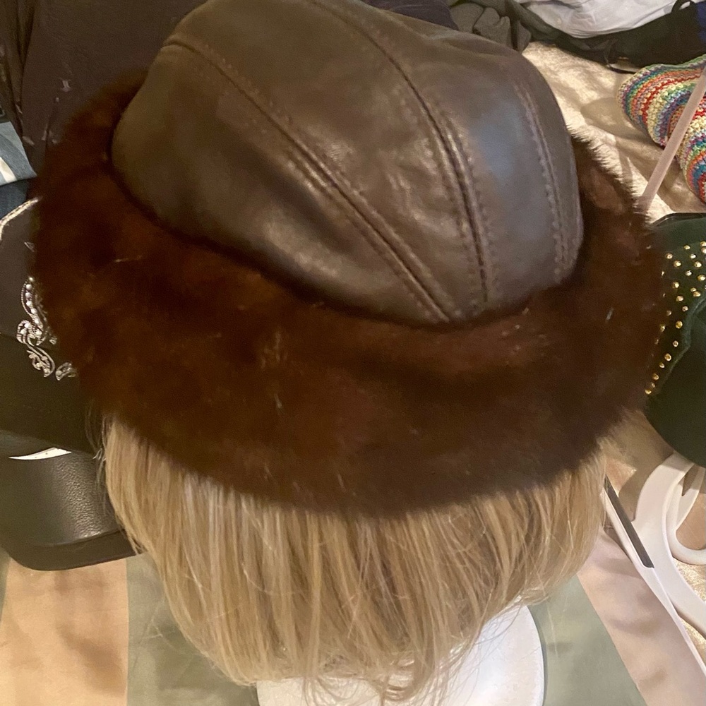 Genuine brown leather real mink trimmed hat. One size.  Worn a couple times